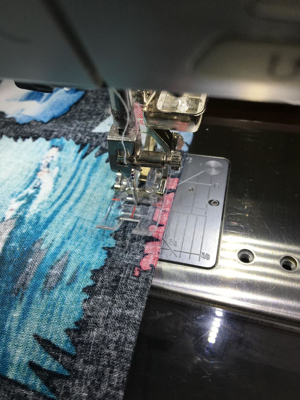 Go back to the sewing machine, sew a 1/2 inch seam down the side you sewed before, ( not the folded side) and across the bottom. You are catching the 1/4 seam you sewed inside of this seam....