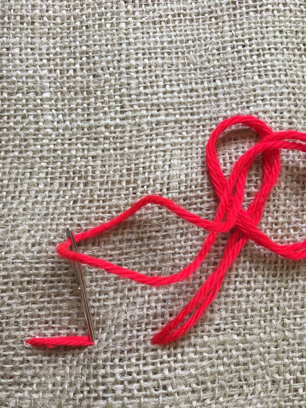 Go backwards with your stitch. Go down in the same hole as the end of your last stitch.