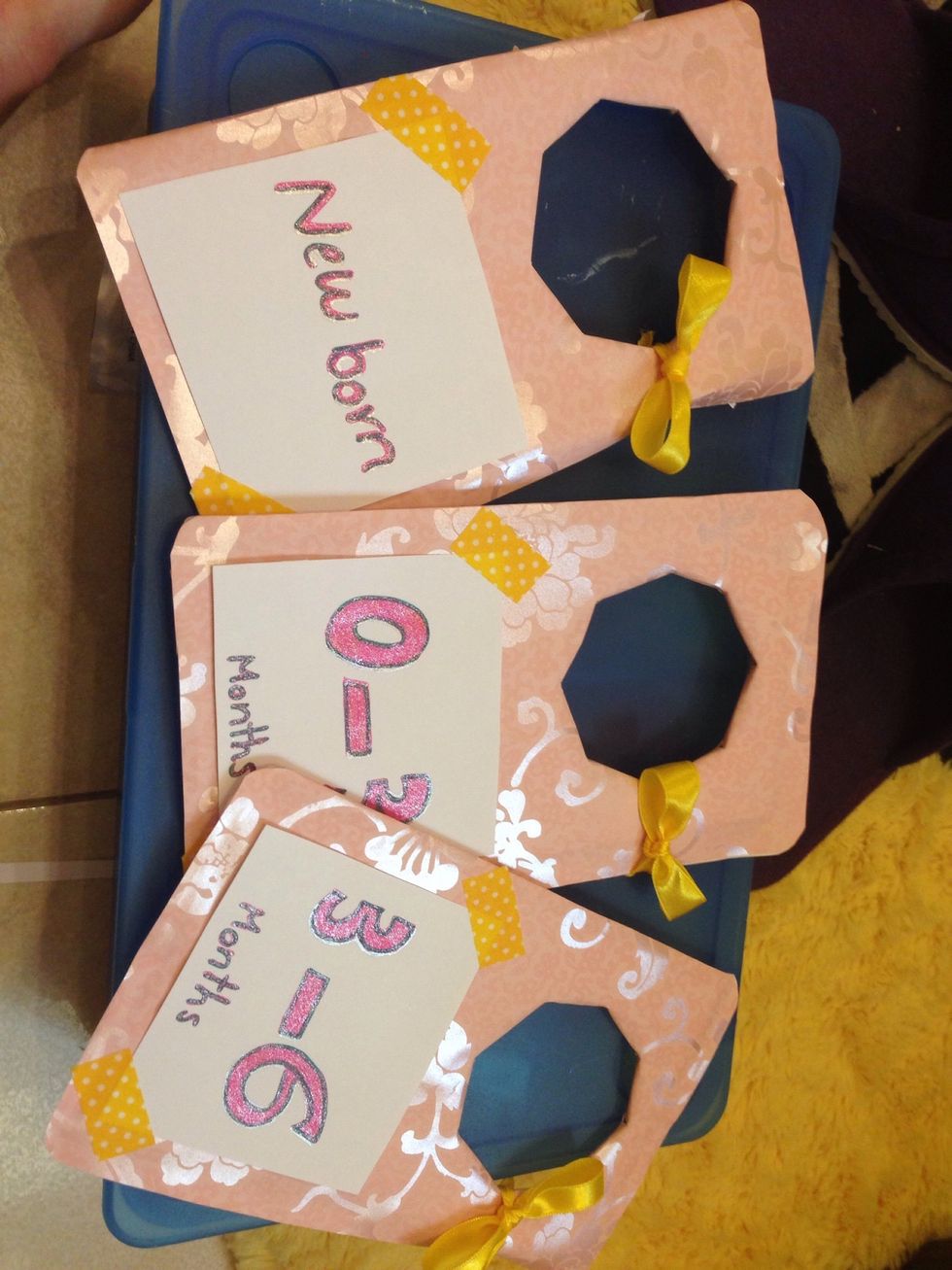 Go crazy decorating your deviders. Then print out or write the sizes of the clothes. Paste them on deviders.