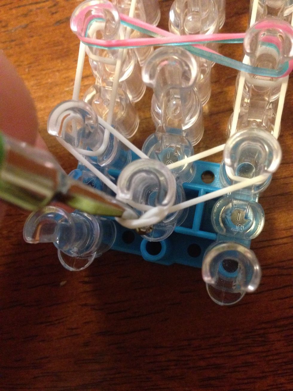 Go inside the cap band and grap the top band.