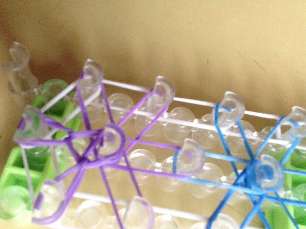 Go on the middle peg push under the captain band and pull the first one to the side.