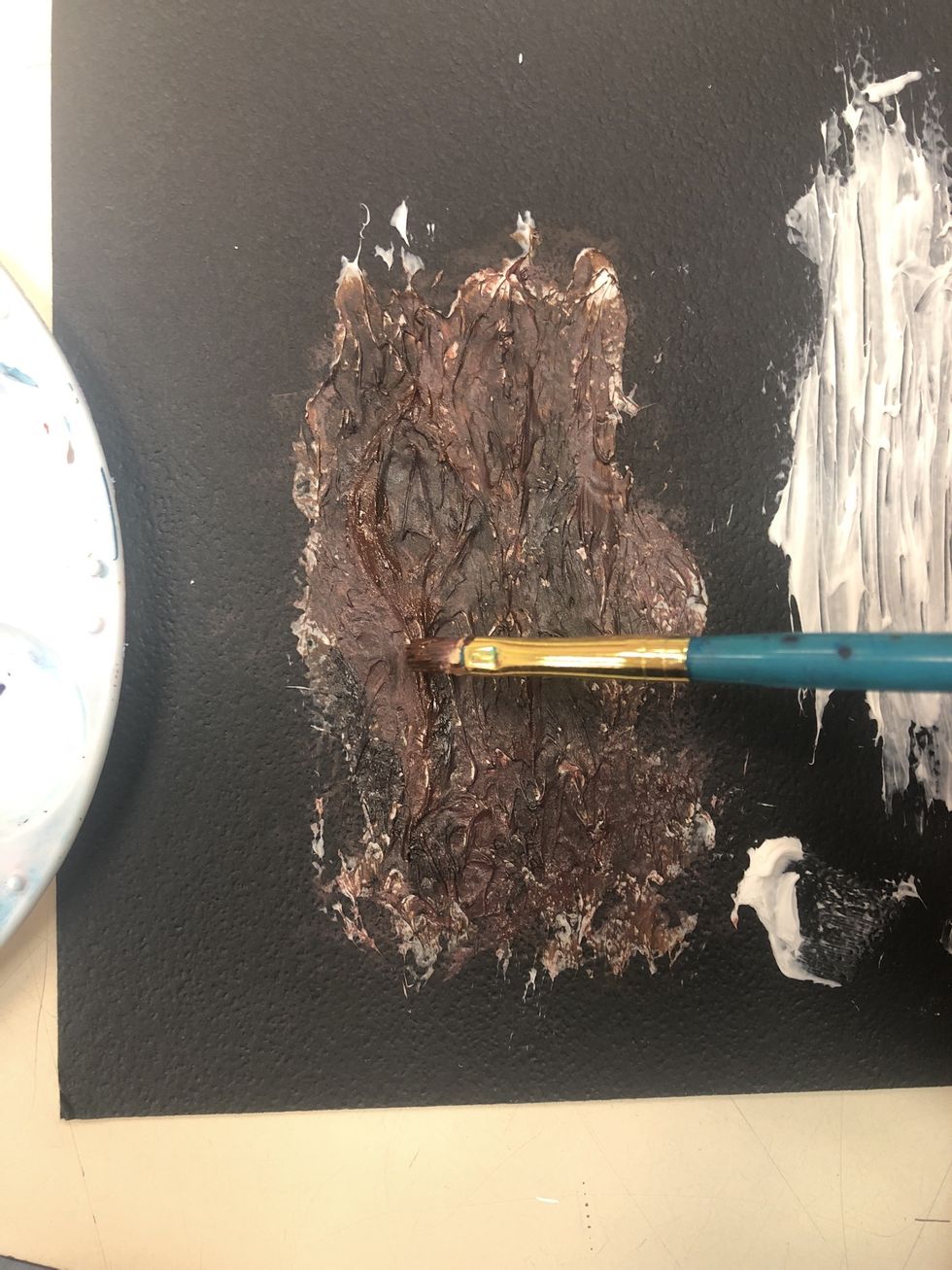 Go over with a lighter brown. Focus more on the higher parts of the bark.