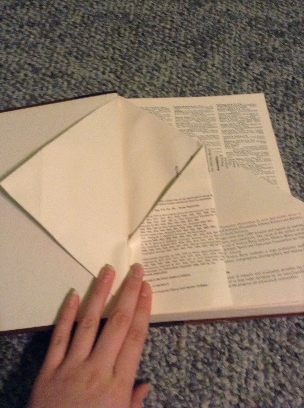 Go to the next page and fold the entire right side into the center.