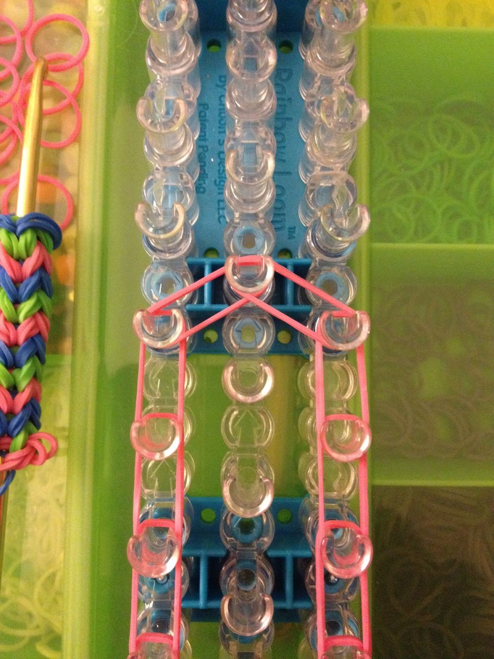 Going from the left take two rubber bands and go towards the center. So the same thing from the right.