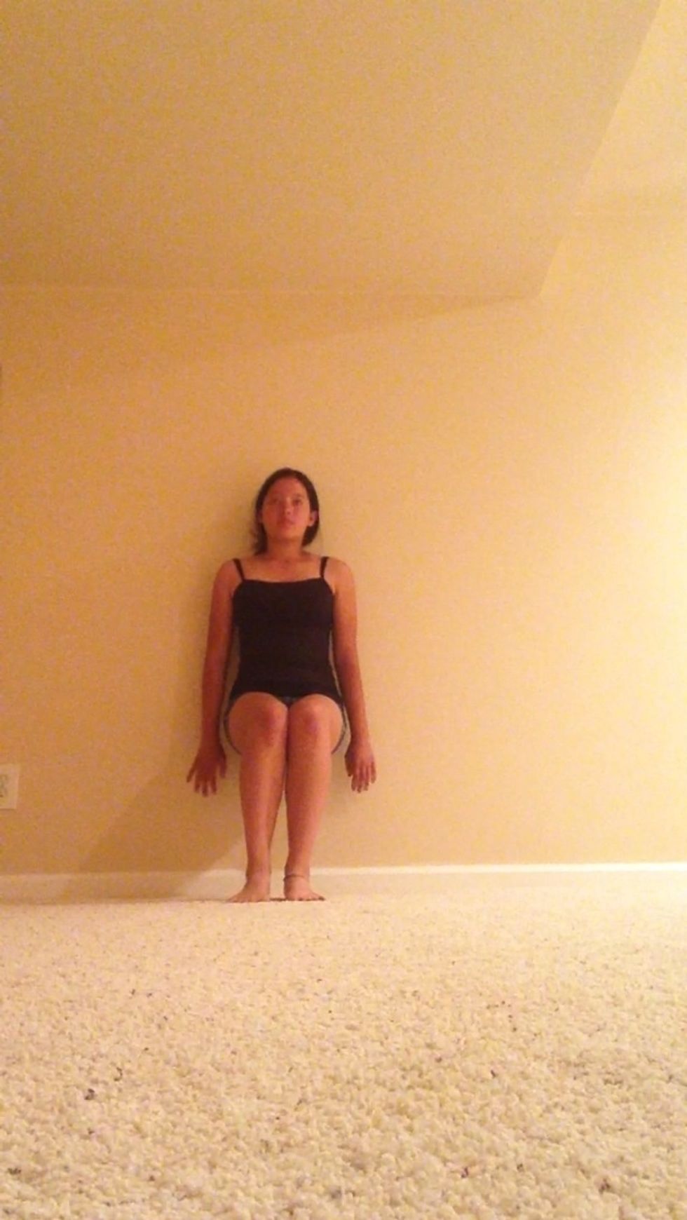 Going on into wall sits lean against a wall and pretend you're sitting in a chair. Hold this in for about 30 sec to a min.