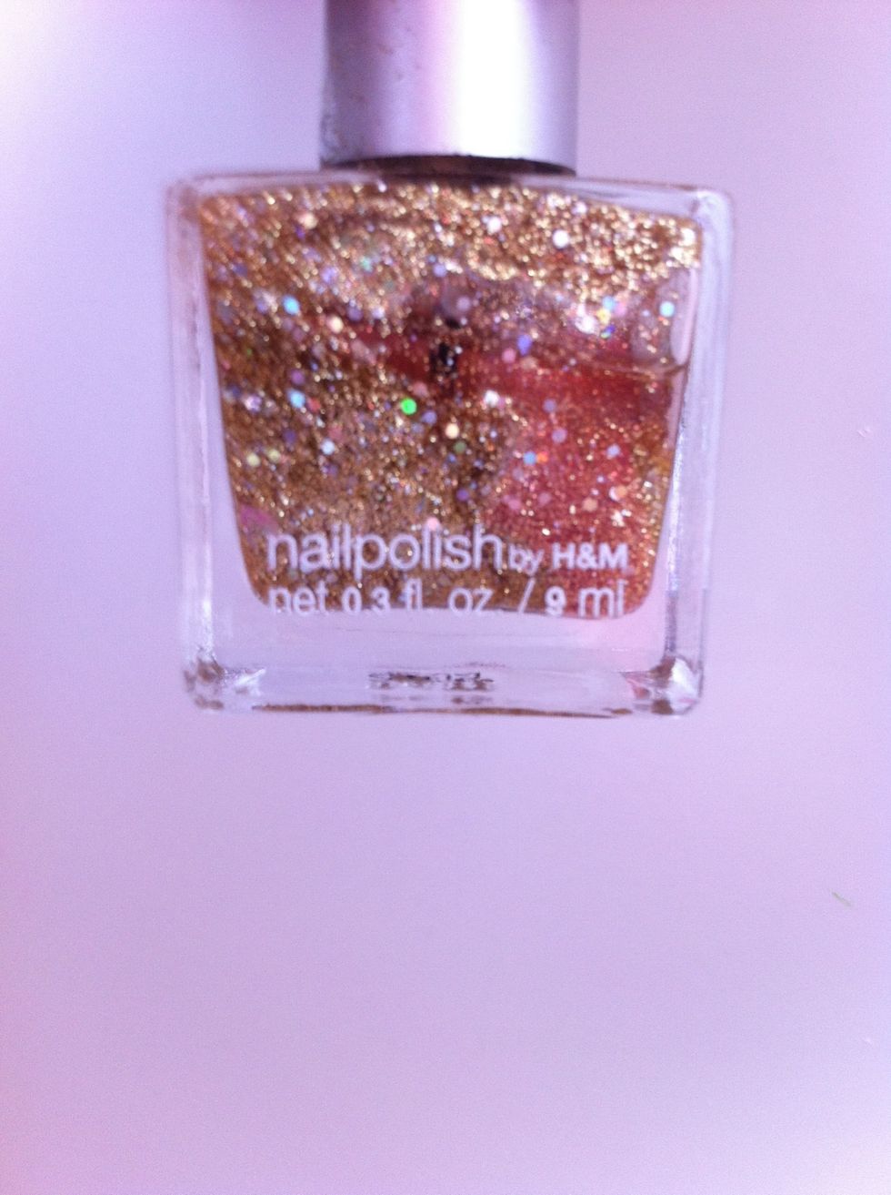 Golden/glitter nail polish. From H&M.
