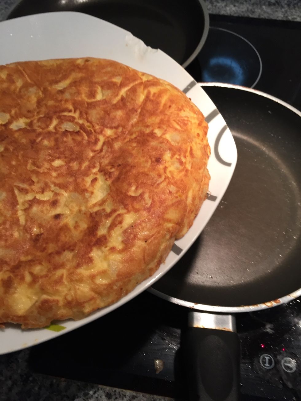 Good! Now we slide the tortilla in the pan