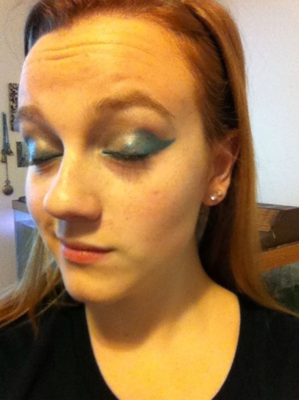 Got me some Hawks wings now! Okay, now some green!! I'm going to put a little green eyeliner in to add some new color.