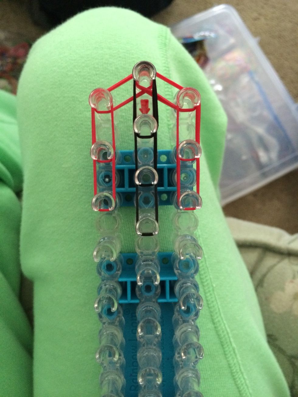 Grab 6 black rubber bands and placed 3 sets down the middle.