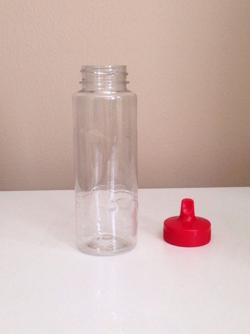 Grab a clean bottle. I'm using an old agave nectar bottle. I like the cap because it's easier to squirt the cleanser onto a cotton pad.