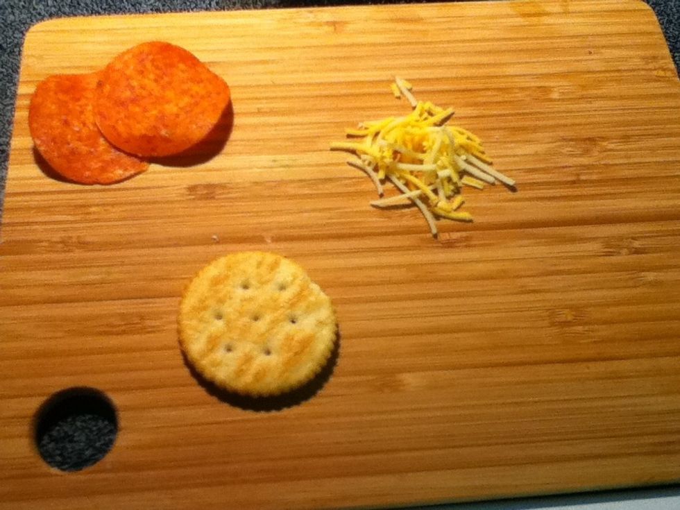Grab a cracker, 2 pepperoni slices, and a pinch of cheese