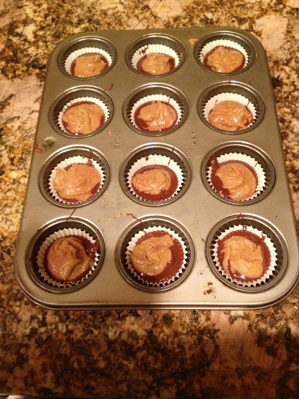 Grab a heaping teaspoon of the peanut butter mixture and roll it into a semi-ball. Flatten it slightly. Drop it in the middle of the chocolate.