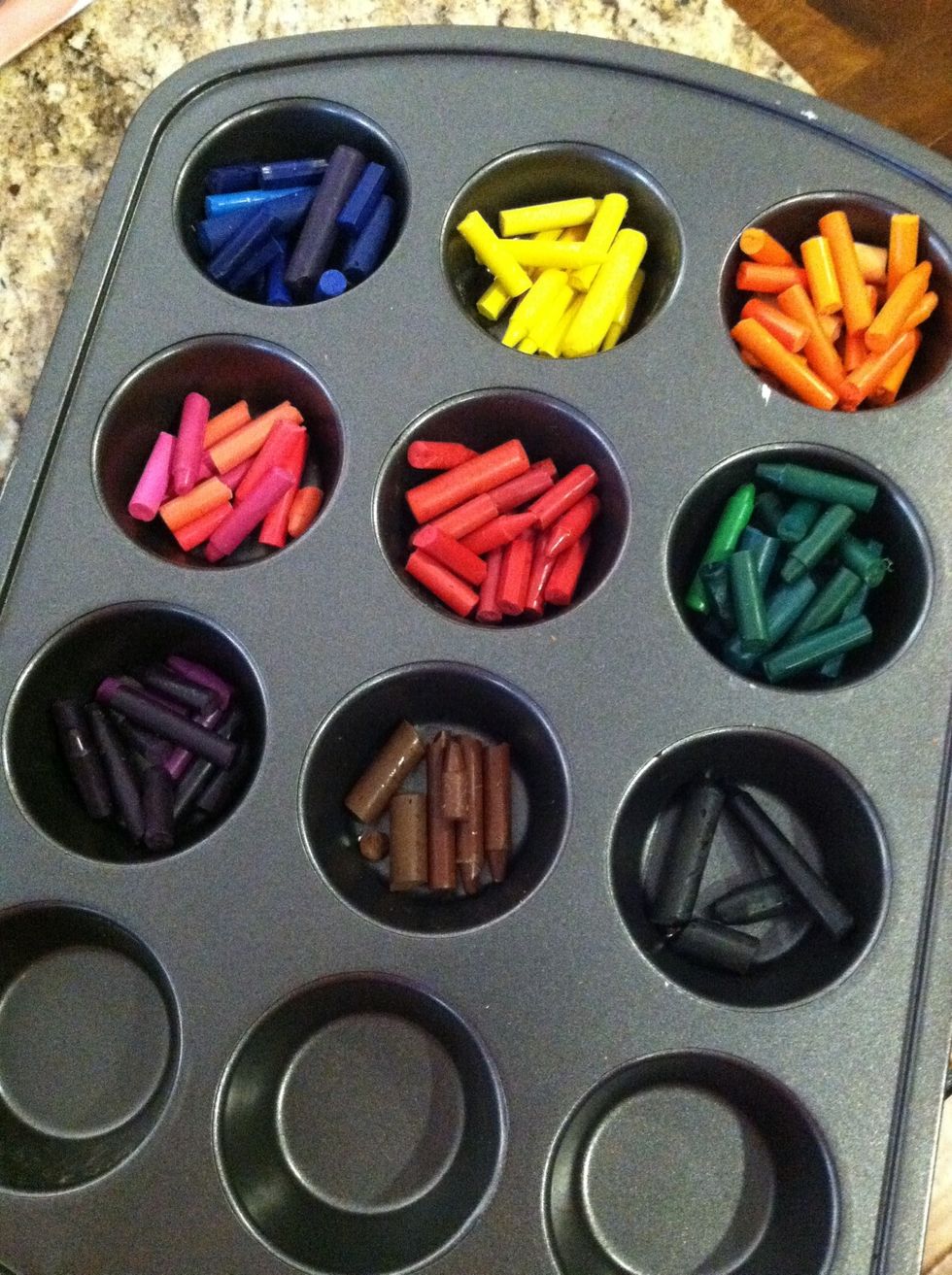 Grab a metal cupcake pan and sort the crayons by color...break any crayons into smaller prices that don't fit. Bake at 250 degrees for about 10 minutes or until crayons are melted.