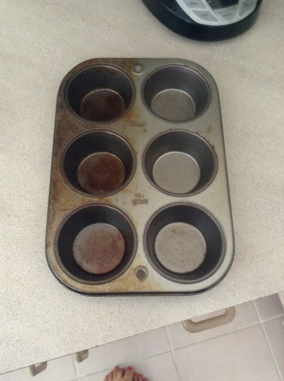 Grab a muffin tin and preheat your oven to 400 degrees. Spray your pan with cooking spray.