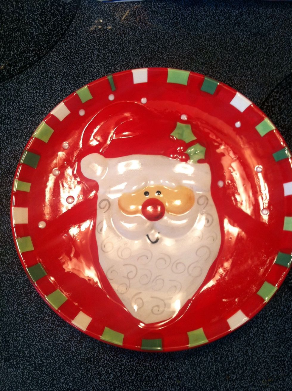 Grab a plate that you will melt your marshmallows on. A Santa Claus plate works best!