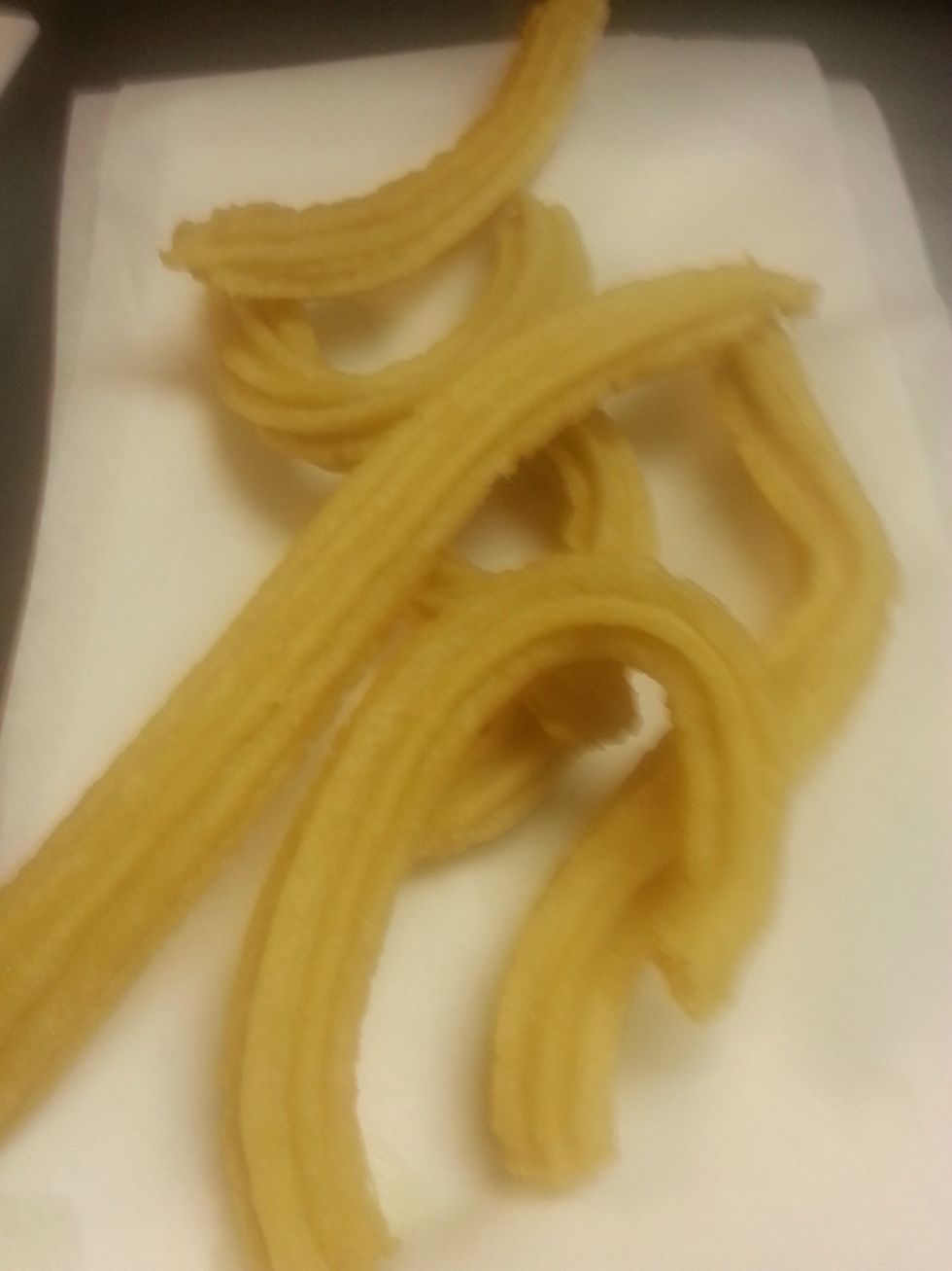 Grab a plate with paper towels and add the churros to drain the oil in the plate and to cool a little bit