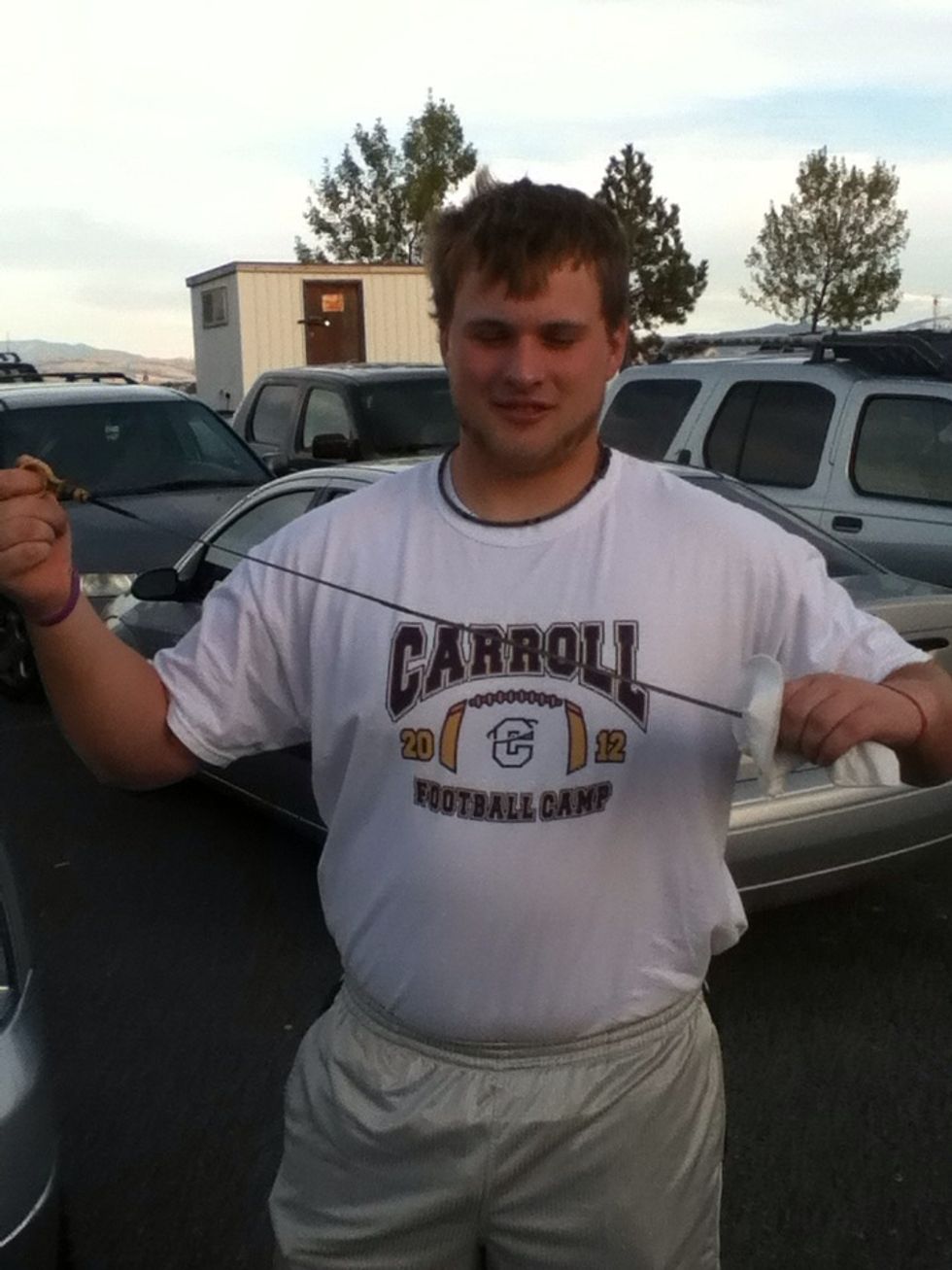 Grab a rag or tissue and wipe the existing oil from the oil stick.