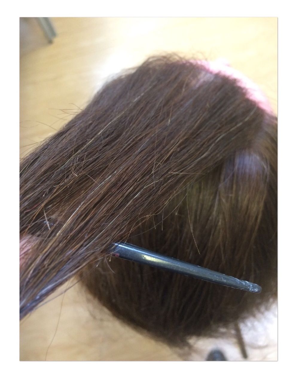 Grab a section of hair from the top of your head