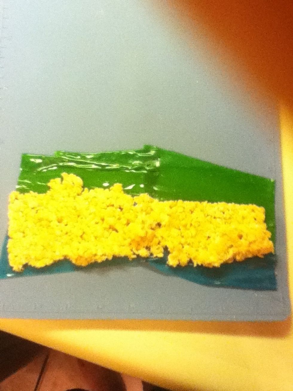 Grab a sheet of crispies an lay them on the roll ups, leaving a bit of roll up showing at the top. (if you were impatient like me, the crispies will fall apat. WAIT FOR THEM TO SET)