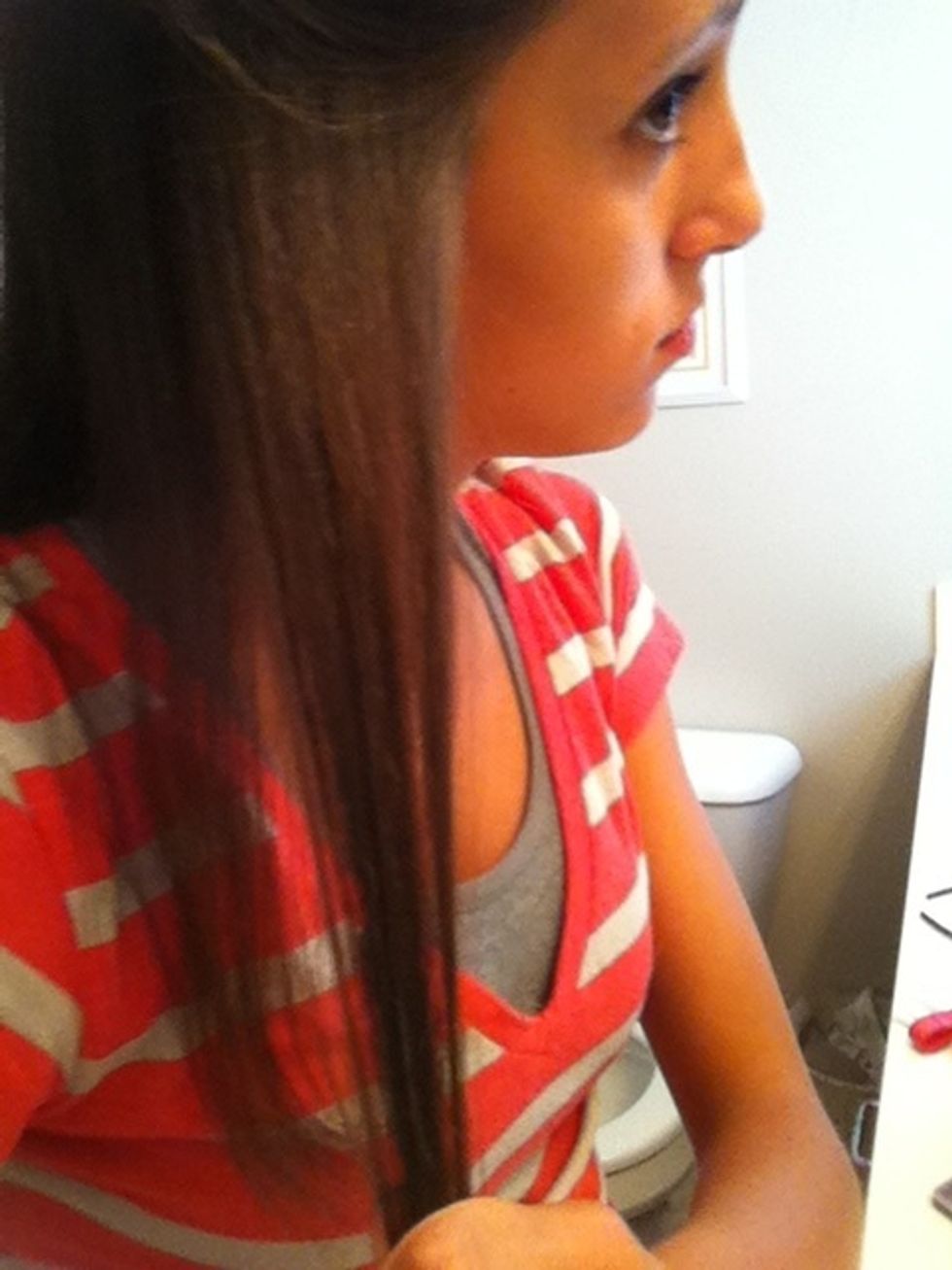 Grab a small section of your hair that you left down