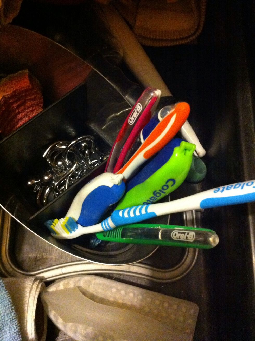 Grab a toothbrush from your old toothbrush pile. (When we get ready to toss a toothbrush for a new one..we throw in here to use disposable brushes for cleaning.)