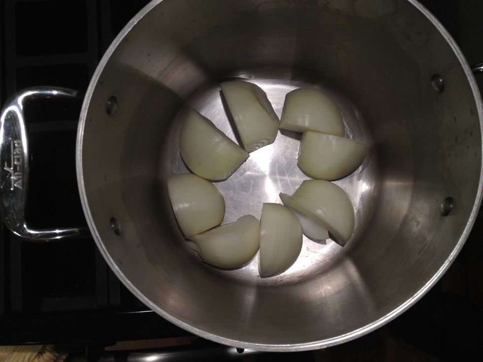 Grab a very large (8 to 10 quart) stockpot. Add 1 pound of onions quartered