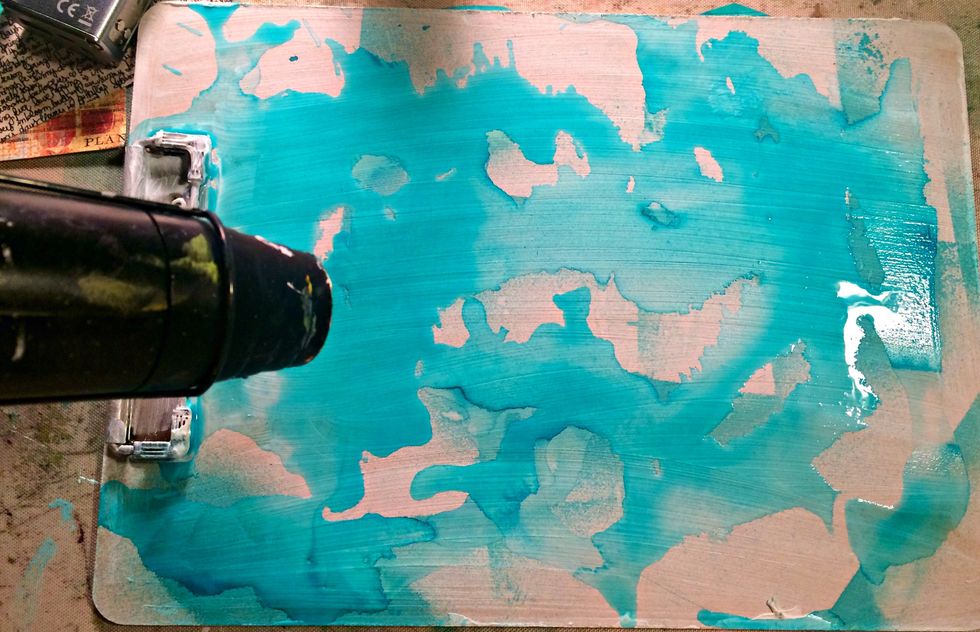 Grab AA Colorations Mist in Studio Blue and a piece of paper cover different areas of the clipboard and mist...this way it leaves some white space...no worries about lines...they will disappear...
