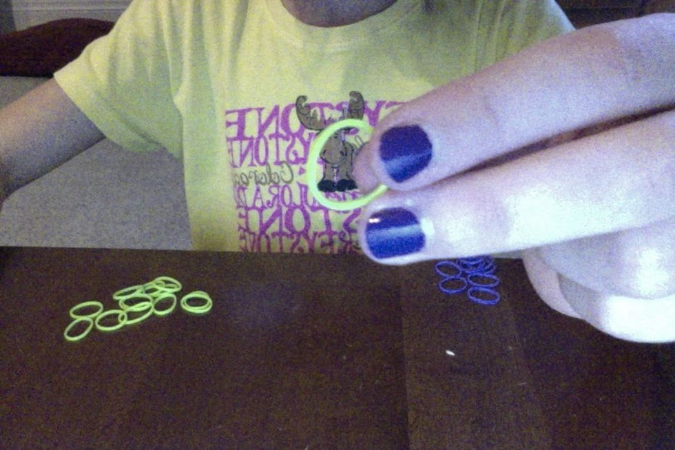 grab again another rubber band and put it on top of you're purple rubber band