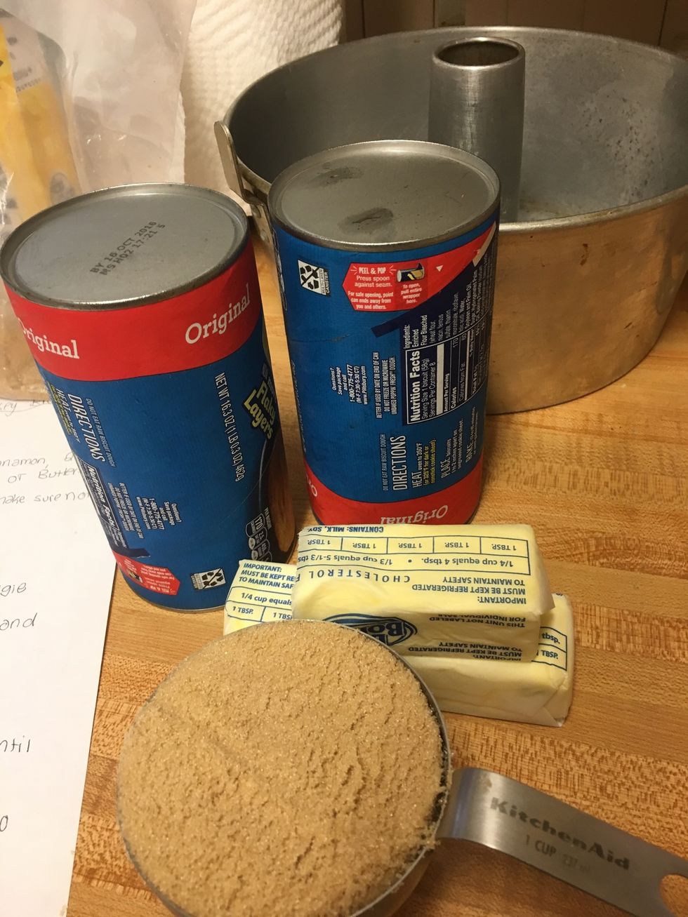 Grab all ingredients: Sugar, Cinnamon, 2 cans of biscuits, Brown sugar, Butter, Plastic baggies