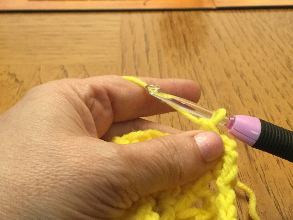 Grab and loop and pull through 2 loops, grab a loop and pull through remaining 2 loops to create a decreasing DC.