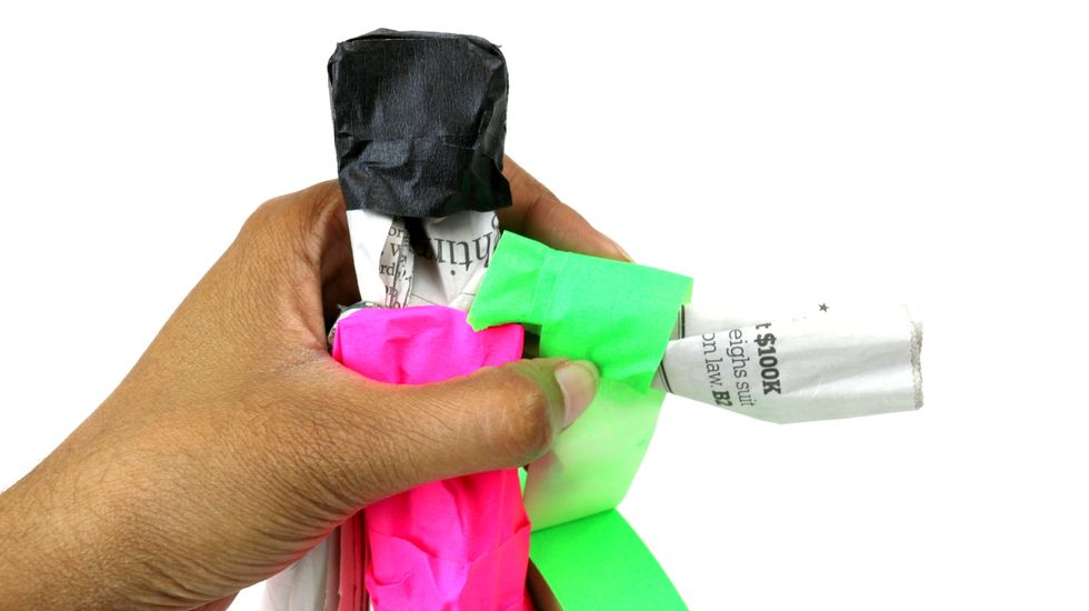 Grab another color of masking tape to wrap around the arm.