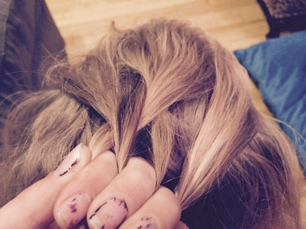 Grab another strand from the other side and do the same thing as in step 4