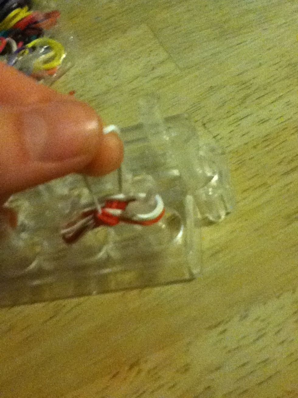 Grab bottom band and then again place it in the middle