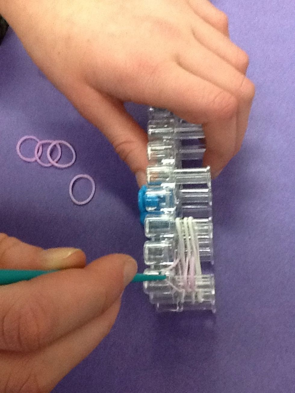 Grab bottom band of the first color with your hook (or finger).