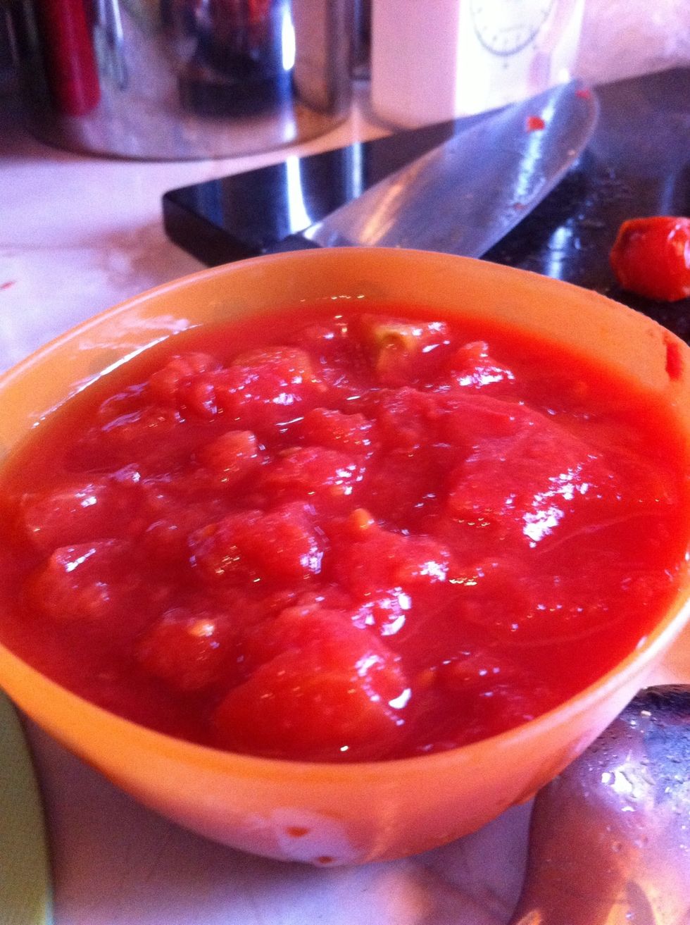 Grab half a tin of chopped tomatoes.