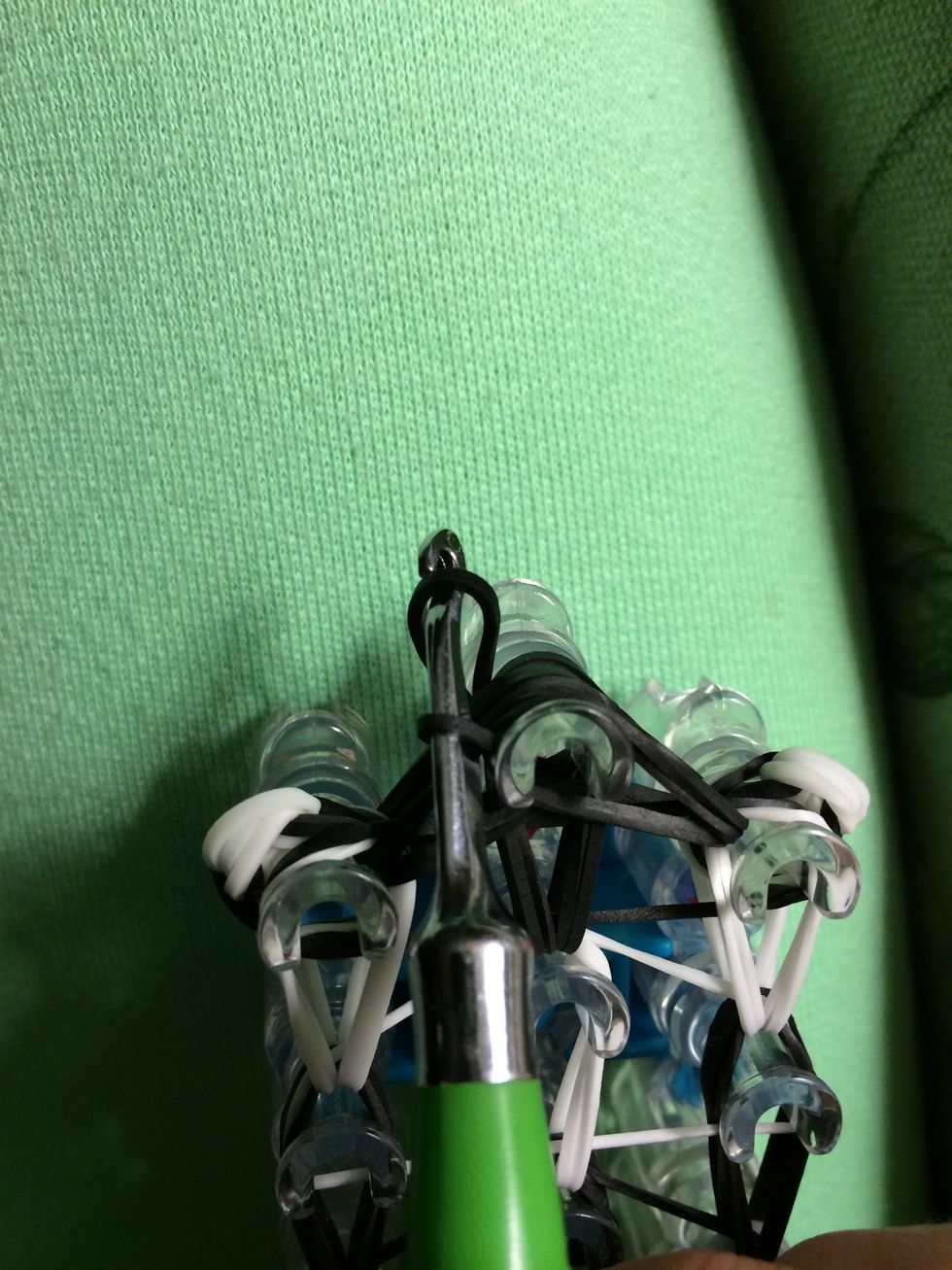 Grab one last black band and make a slipknot.