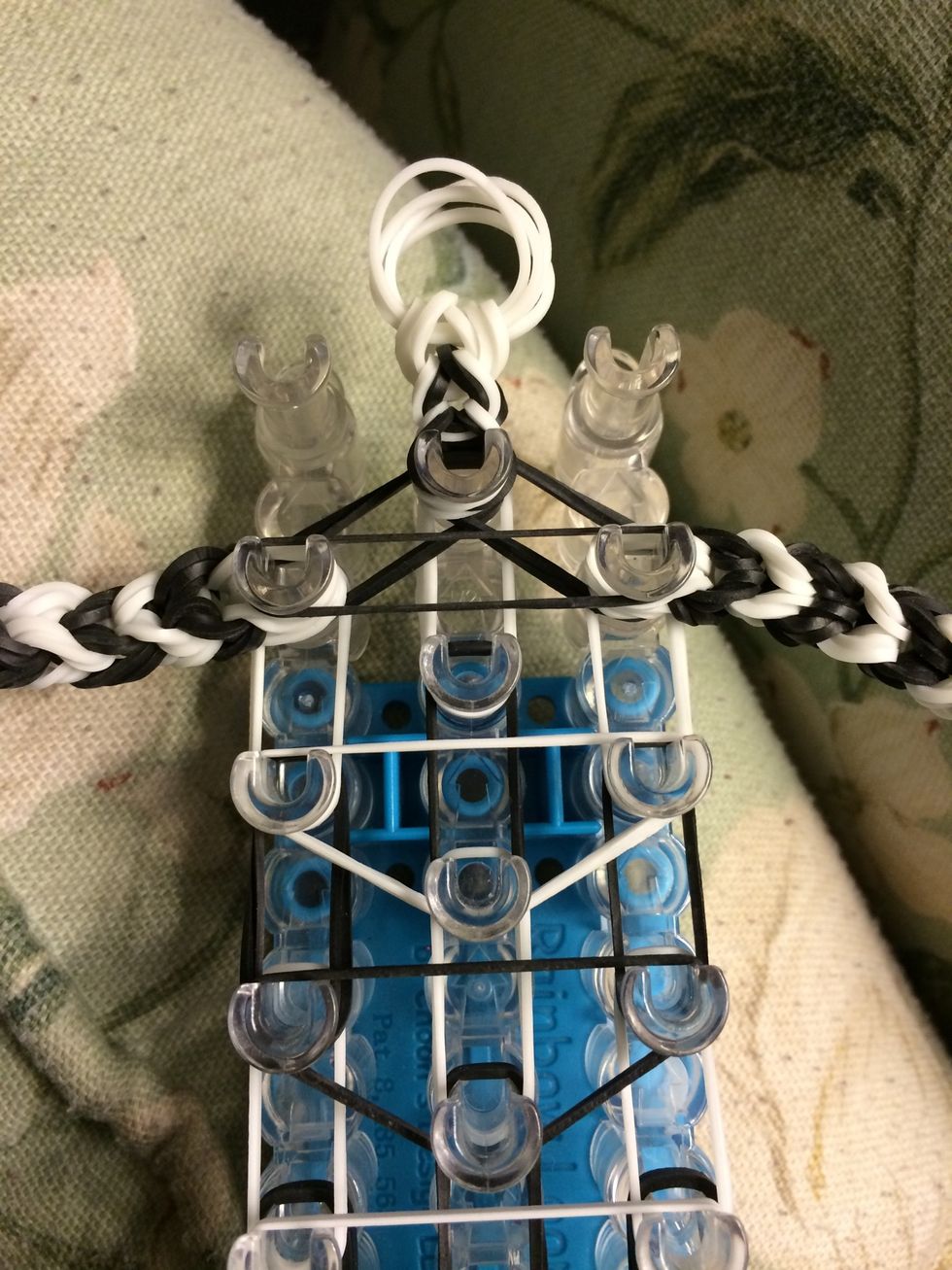 Grab one of black band and place it across the legs this will be the last capping band