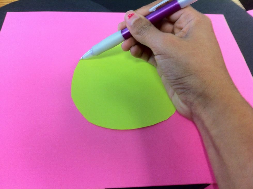 Grab one of the circles you just cut and put it in the center of a new colored sheet of paper. Begin tracing the circle and repeat steps 4-6 twice ending up with 6 circles. (3 pink, 3 green)