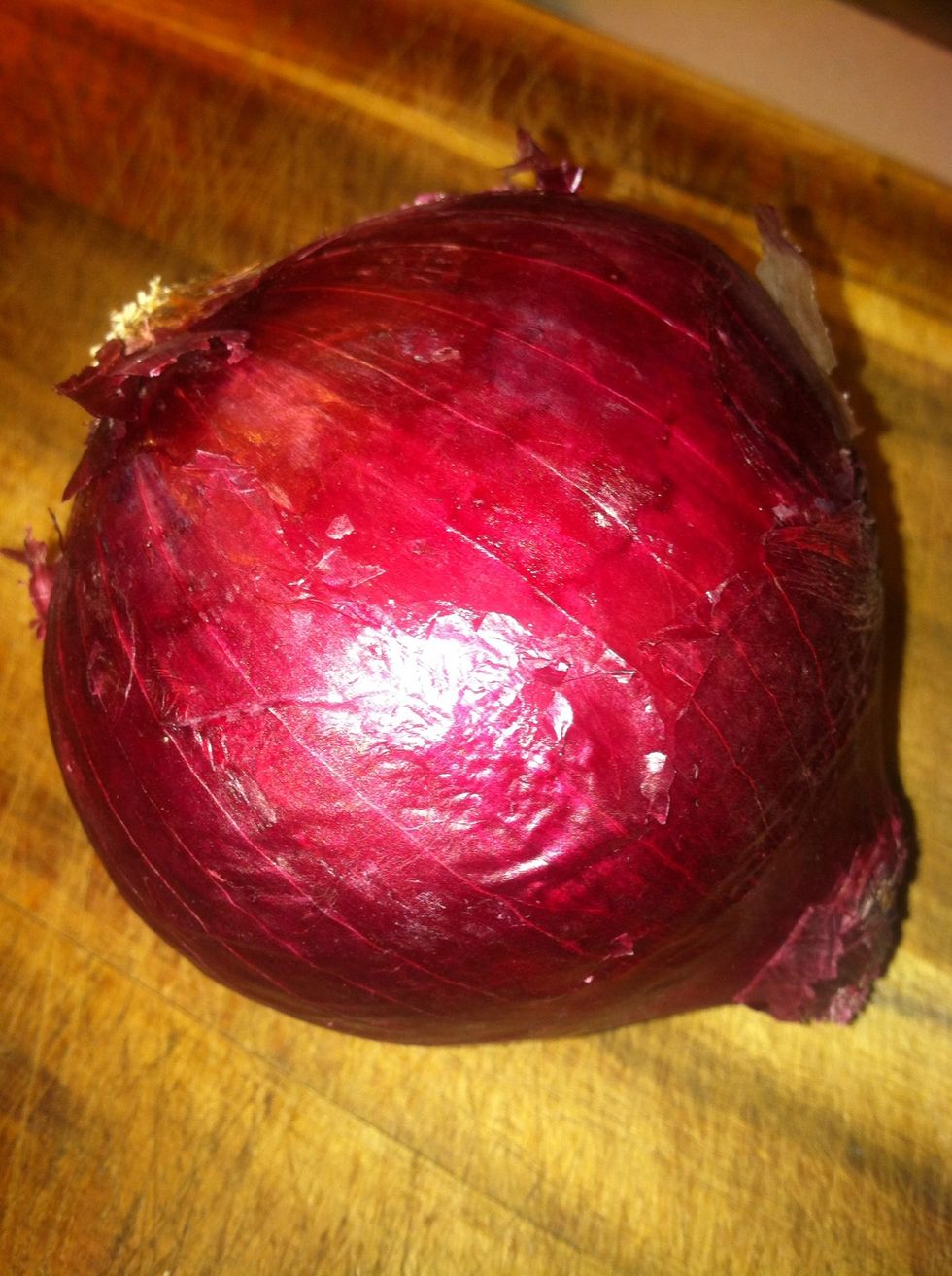 Grab one onion. Cut. The ends off and then cut it in half. (if you want more caramelized onions cut another one too)