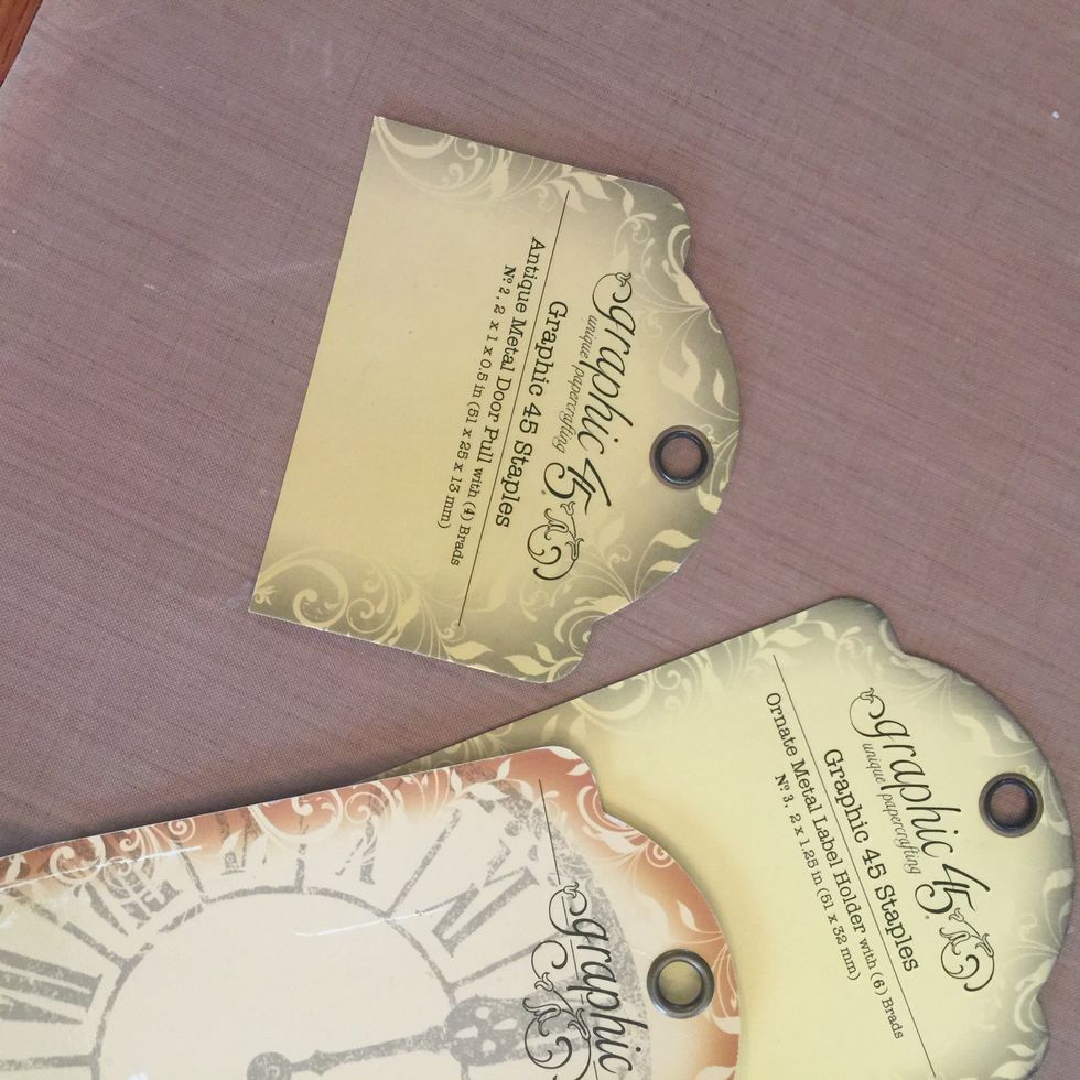 Grab one tag per pocket page and trim a little on the sides so they fit in the pockets and cut them short until you are happy with how far they stick out from the pocket page.