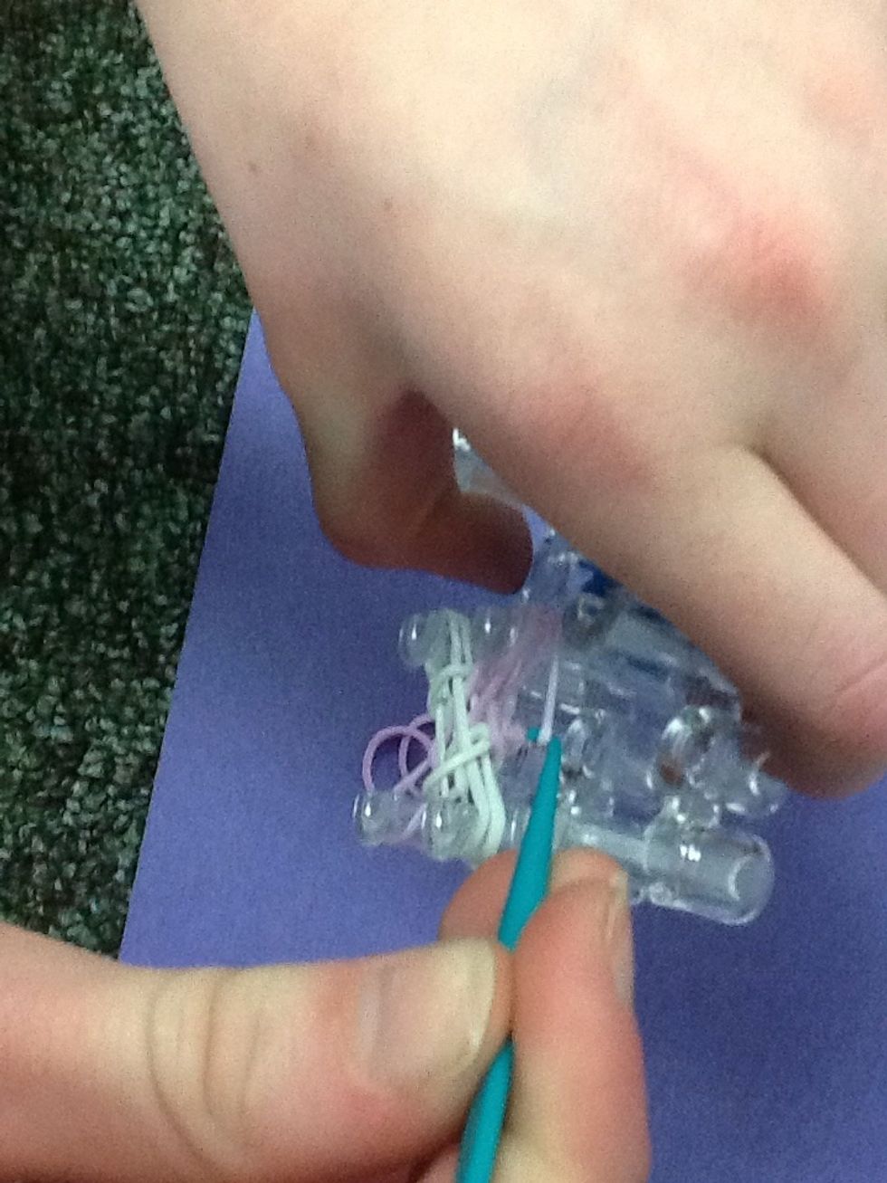 Grab second peg, first color, the bottom band.