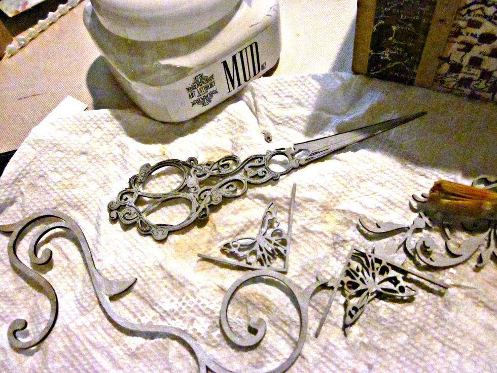 Grab some chipboards from your stash and prime them with Mud Medium