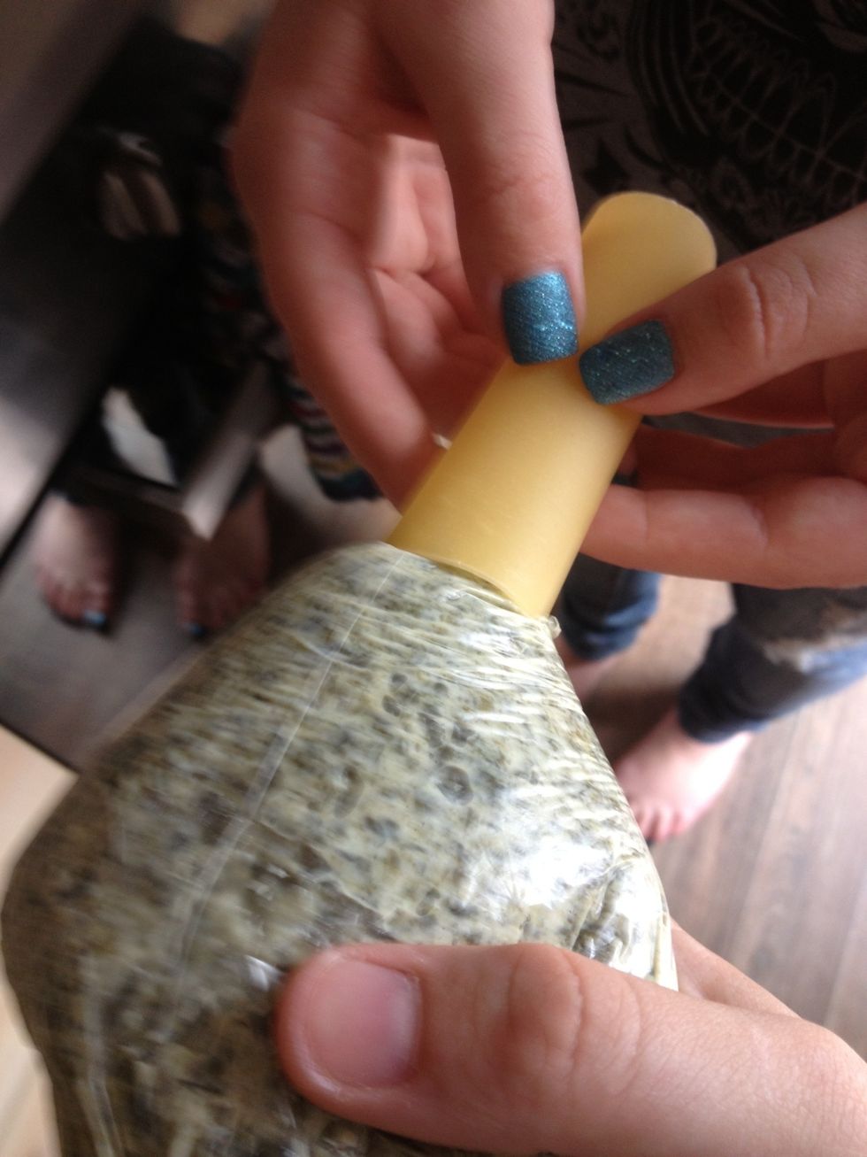 Grab some help to fill the tubes. Put pressure on the bottom of the bag and once the tube is filled place it in the baking dish.