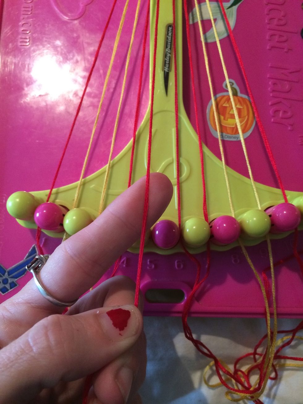 Grab string number 5. Mine is the red one. We are going to be doing the same thing like the right side except we are going Backwards.