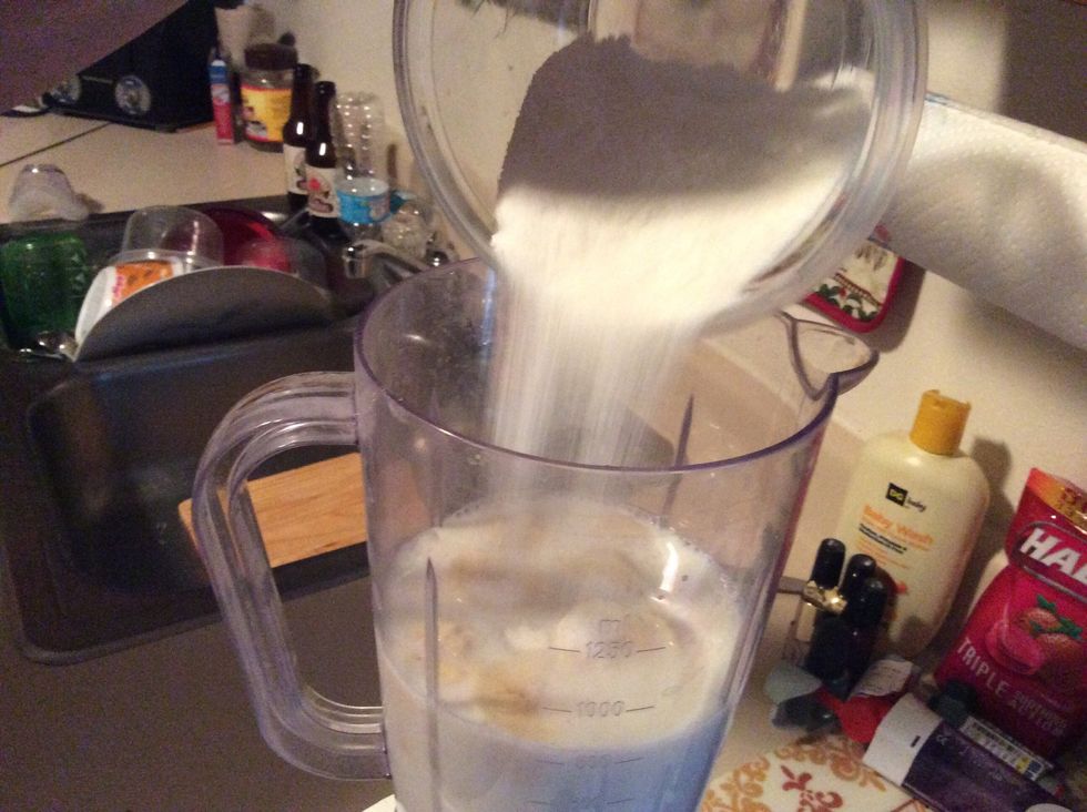 Grab sugar and pour into blender