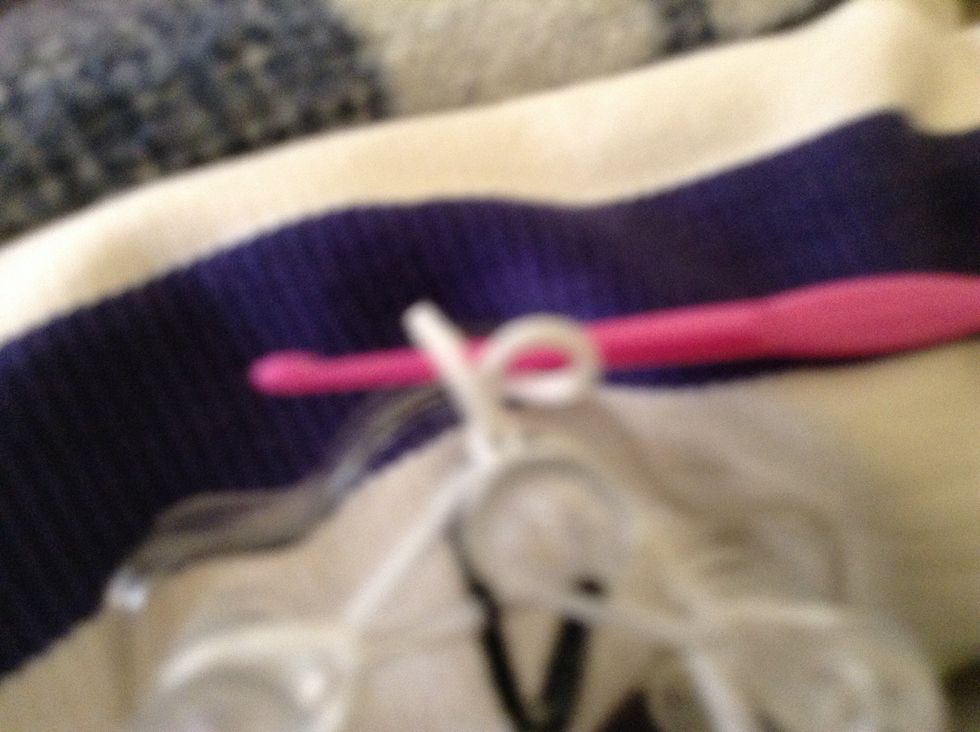 Grab the bit the furthest away from the front and pull it off then tighten it