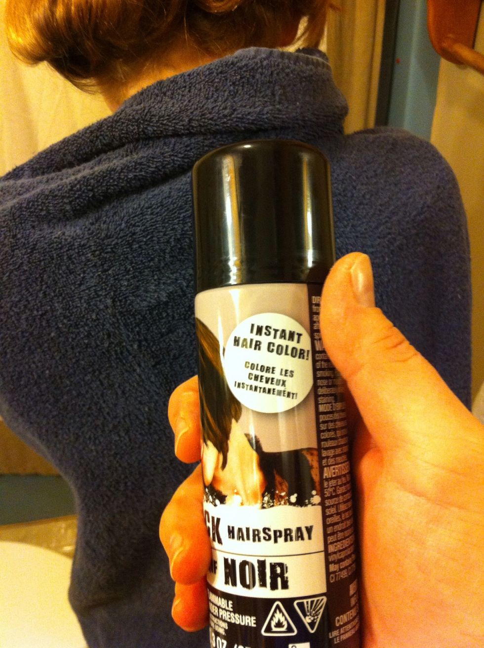 Grab the black hairspray. Shake this up again, at least for 30 seconds. Cover self with towel and the floor. This black will get everywhere. We should have sprayed this outside. But live and learn!\ud83d\udcda