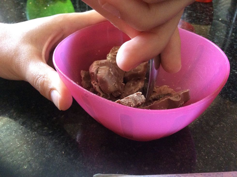 Grab the chocolate of your choosing. If you don't have chocolate chips like us, break up other chocolate. We used fredo frogs
