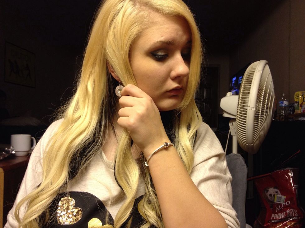 Grab the chunk from behind your ear and pull forward.