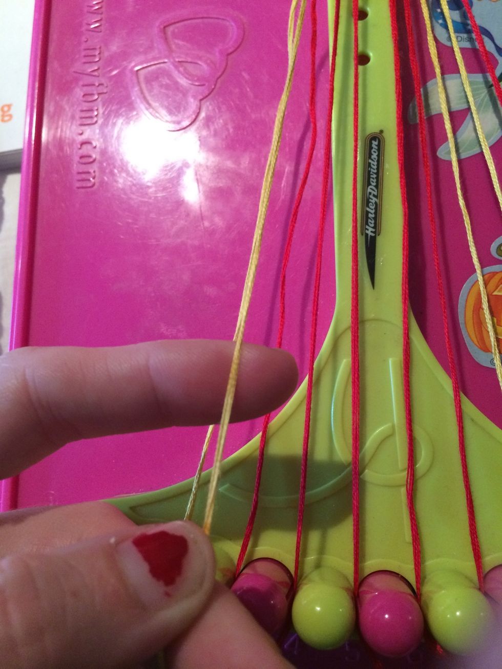 Grab the gold string and make your across using Forward knots.